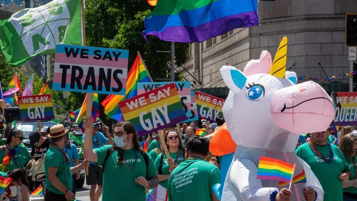 People carrying "We say trans" and "We say gay" signs at Seattle Pride