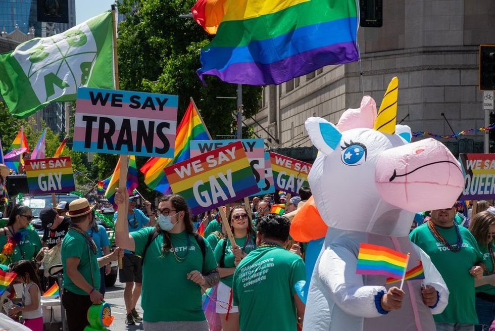 People carrying "We say trans" and "We say gay" signs at Seattle Pride
