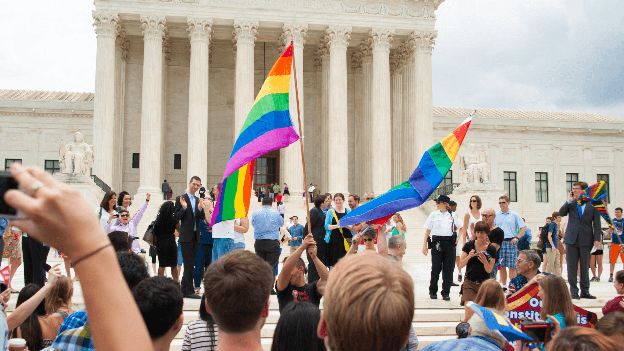 People holding Pride flags gather outside the U.S. Supreme Court after the Obergefell v. Hodges decision in 2015.