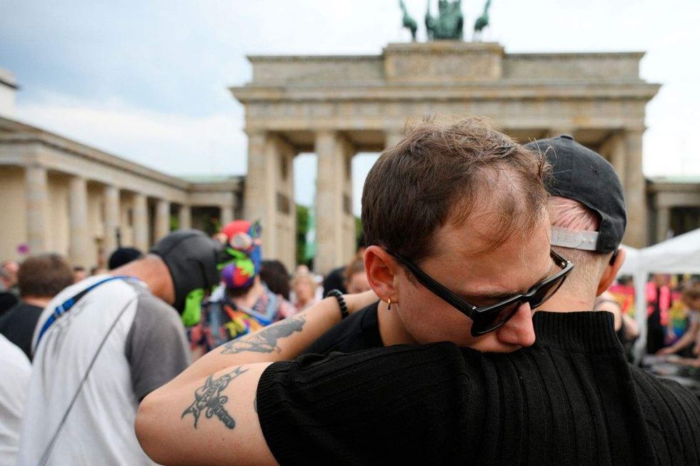 people hugging at mourning event