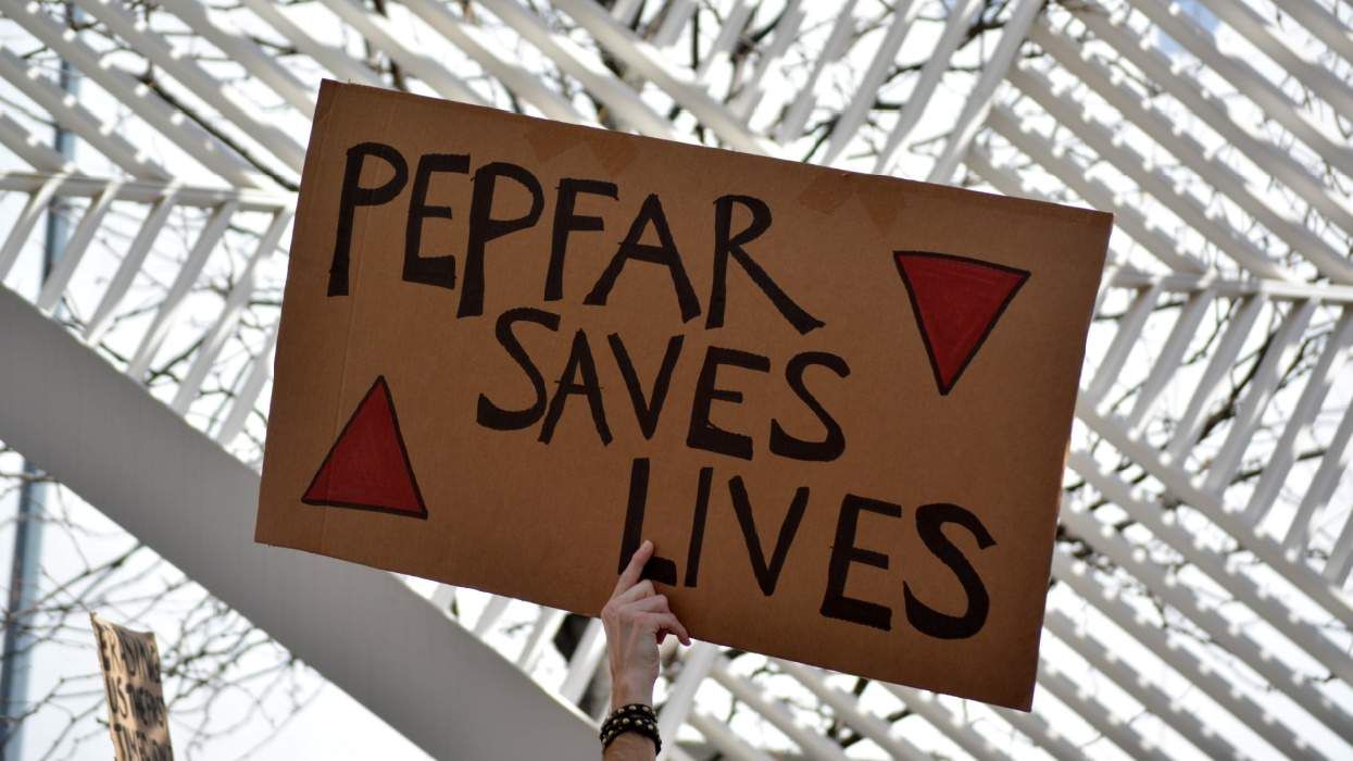 "PEPFAR saves lives" protest sign