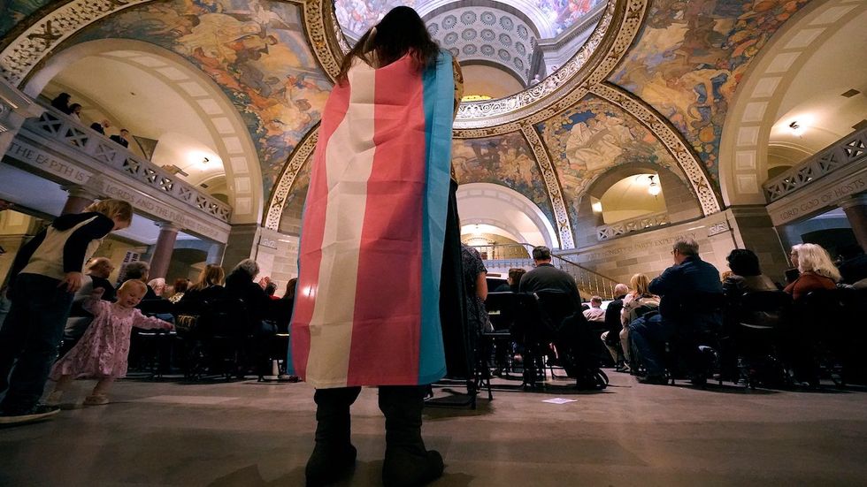 Person with trans flag at Missouri capital