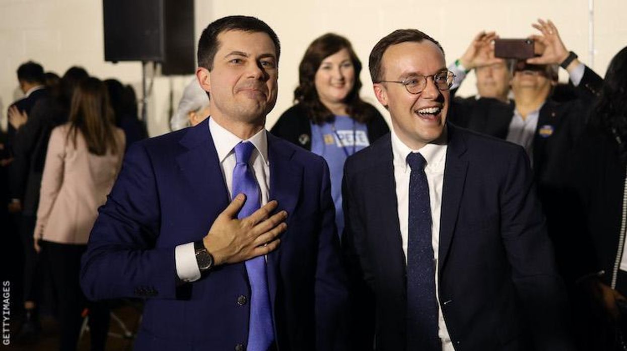 Pete and Chasten Buttigieg embracing.