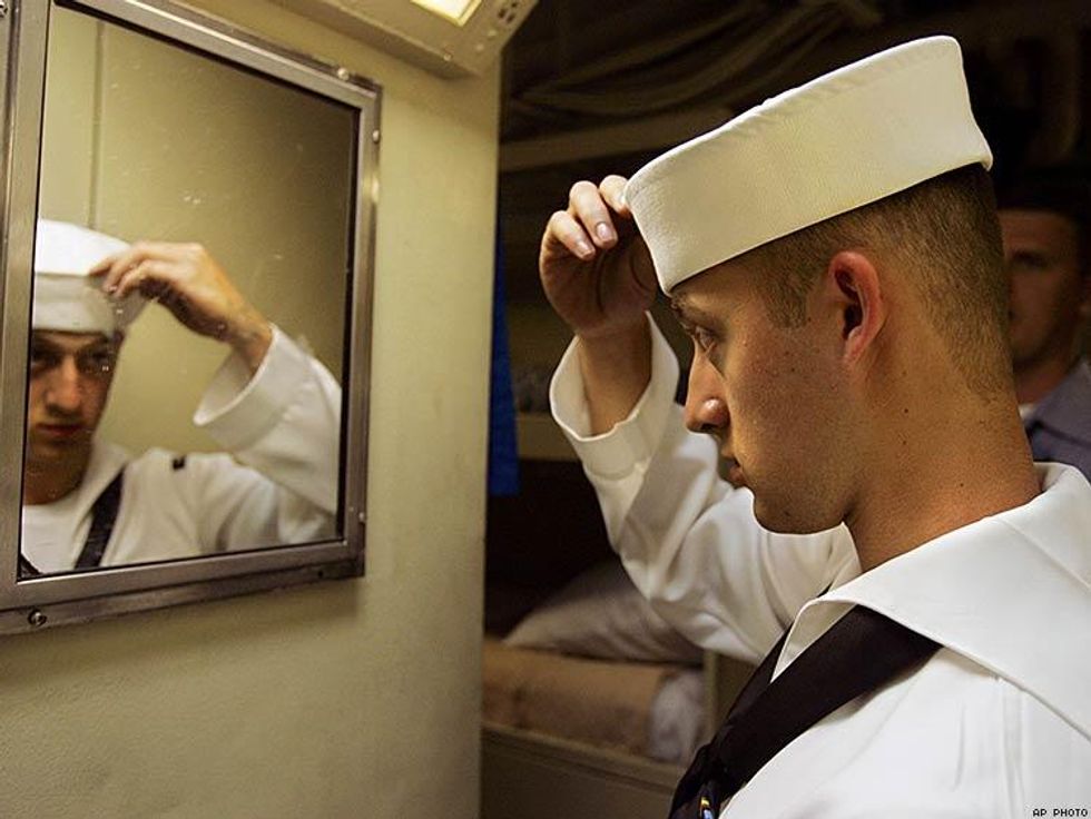 Petty Officer 2nd Class Derrick White of Joplin, Mo., adjusts his cap before heading out on liberty from the U.S.S. Shreveport during Fleet Week Wednesday, May 25, 2005 in New York.