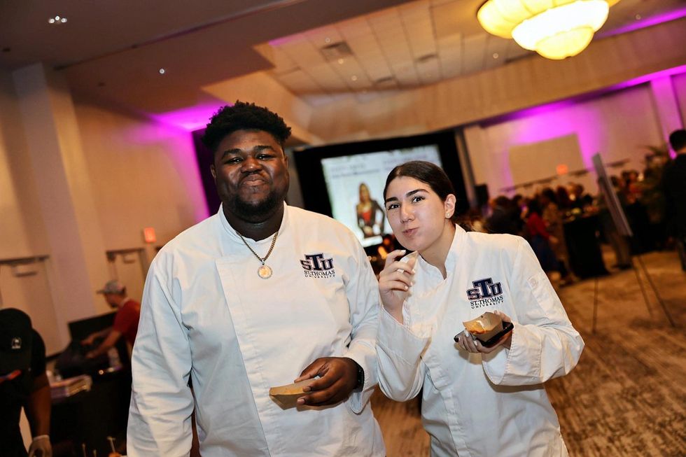 Photo Gallery of Easterseals South Florida's 33rd Annual Festival of Chefs - \u200bSt. Thomas University Culinary Arts program student Chefs D-Andre Lake (left) and Adelfa Plasencia