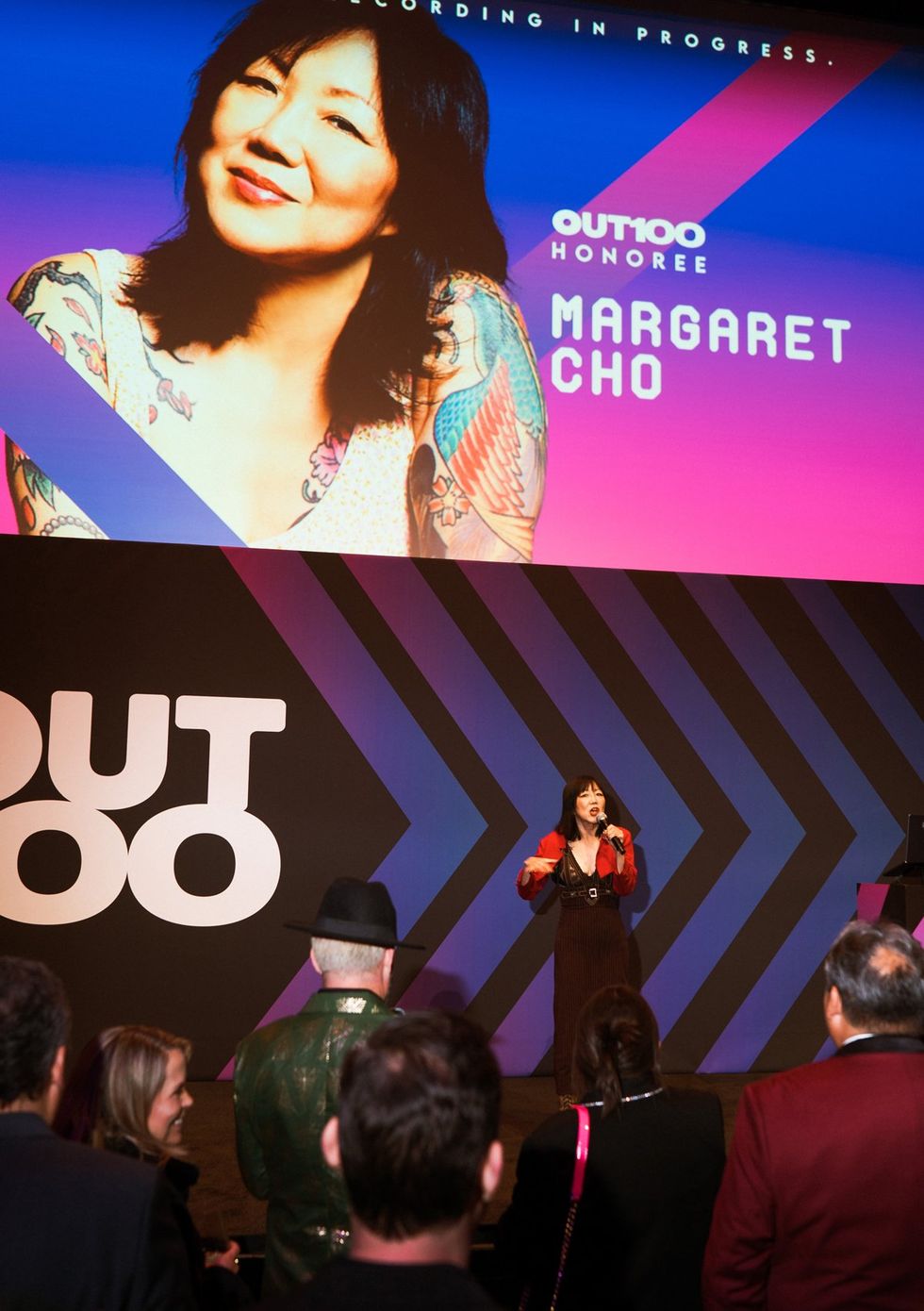 photo gallery queer photographer Roland Fitz Out100 2024 party pics honoree Margaret Cho speaking on stage