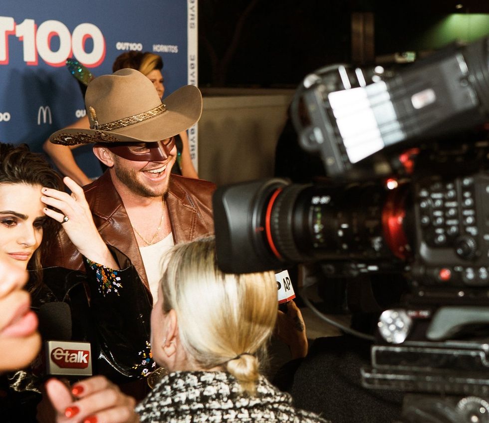 photo gallery queer photographer Roland Fitz Out100 2024 party pics Nava Mau and Orville Peck