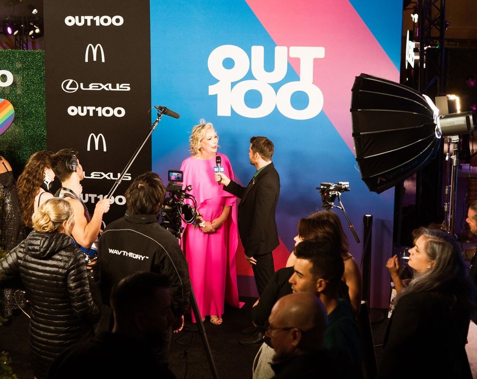 photo gallery queer photographer Roland Fitz Out100 2024 party pics Olivia Hill Nashville Metro Council At-Large being interviewed by Ricky Cornish