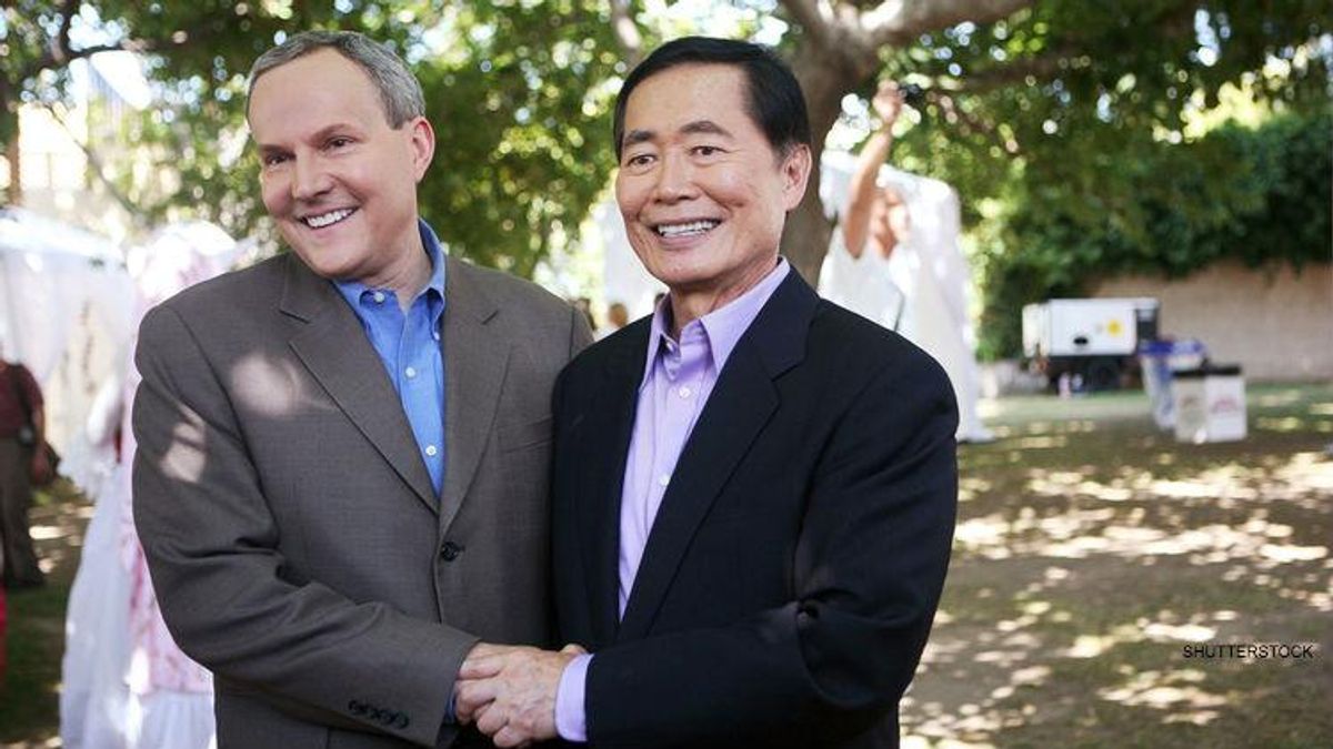[Photo: George Takei stands with his husband as they get a marriage license.]