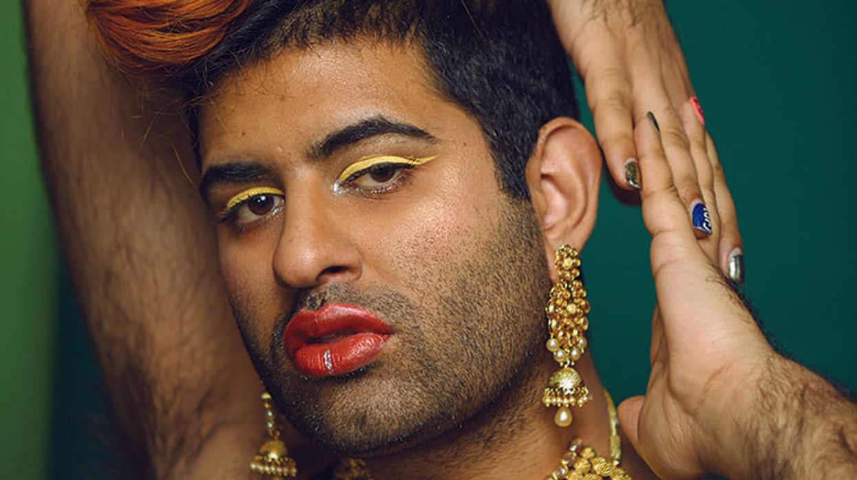 Photo of genderqueer Indian-American artist Alok Vaid-Menon in a gold slip dress