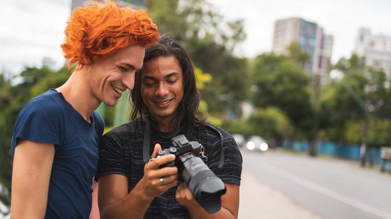 Photographer showing camera