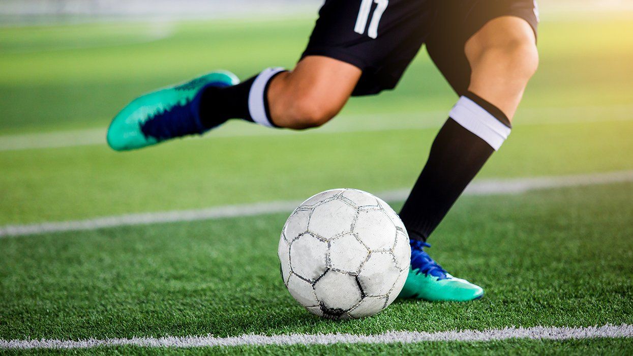 player getting ready to kick soccer ball on field
