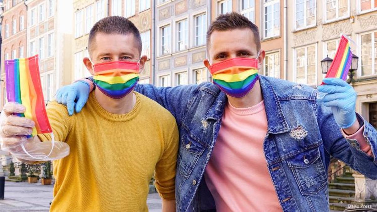Gay Couple Hands Out Rainbow Masks On The Streets Of Poland
