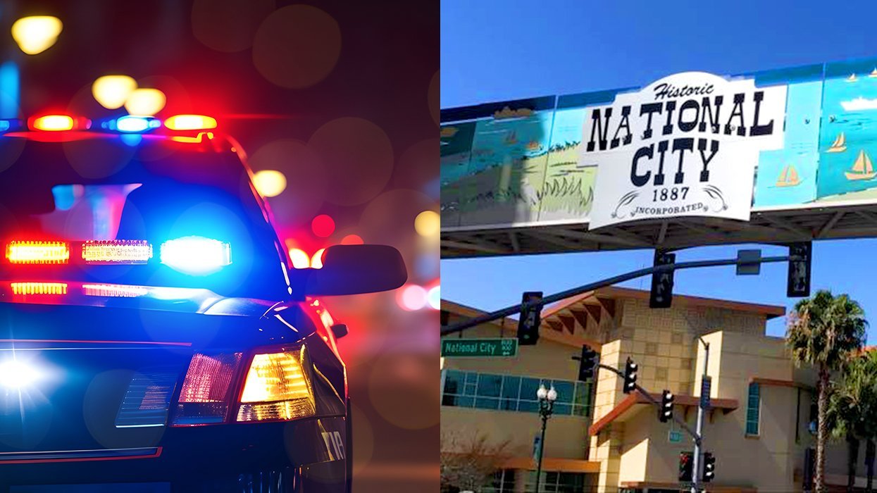 Police car lights flashing alongside historic National City California 1887 billboard