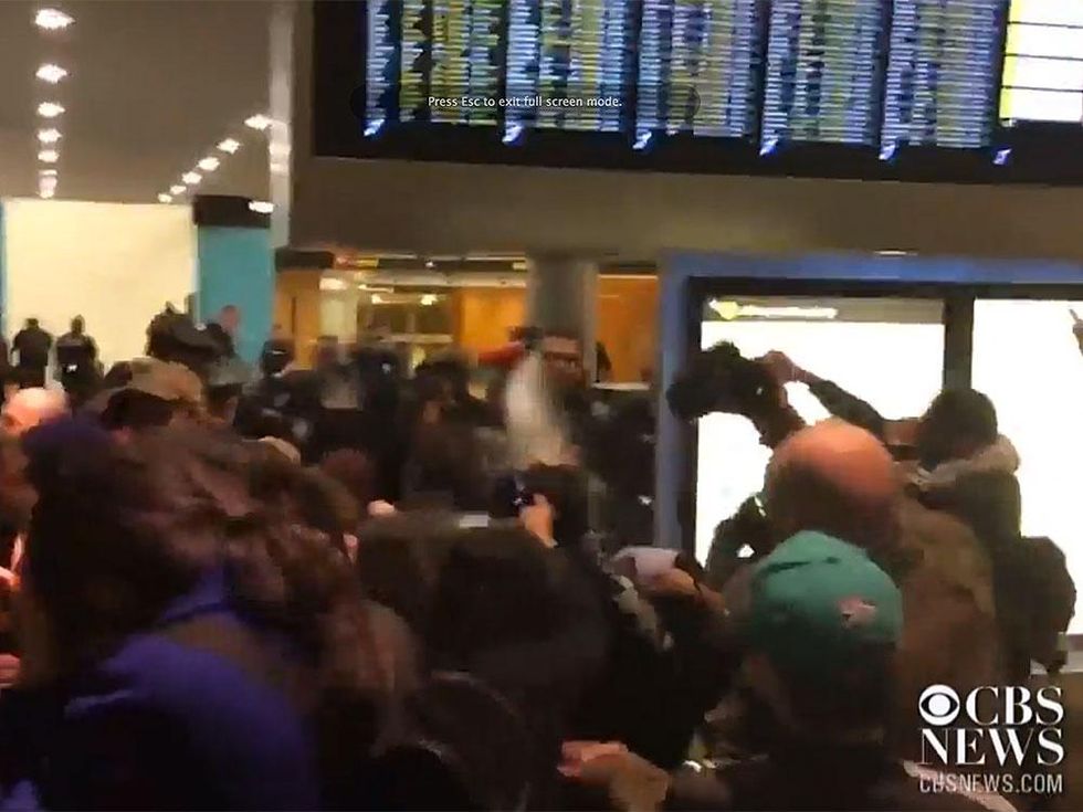 Police pepper spray the crowd at Seattle\u2013Tacoma International Airport