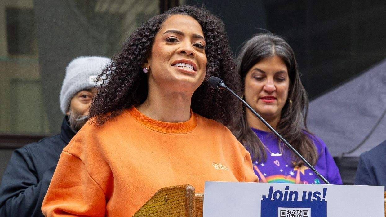precious brady-davis speaking at a hands off rally