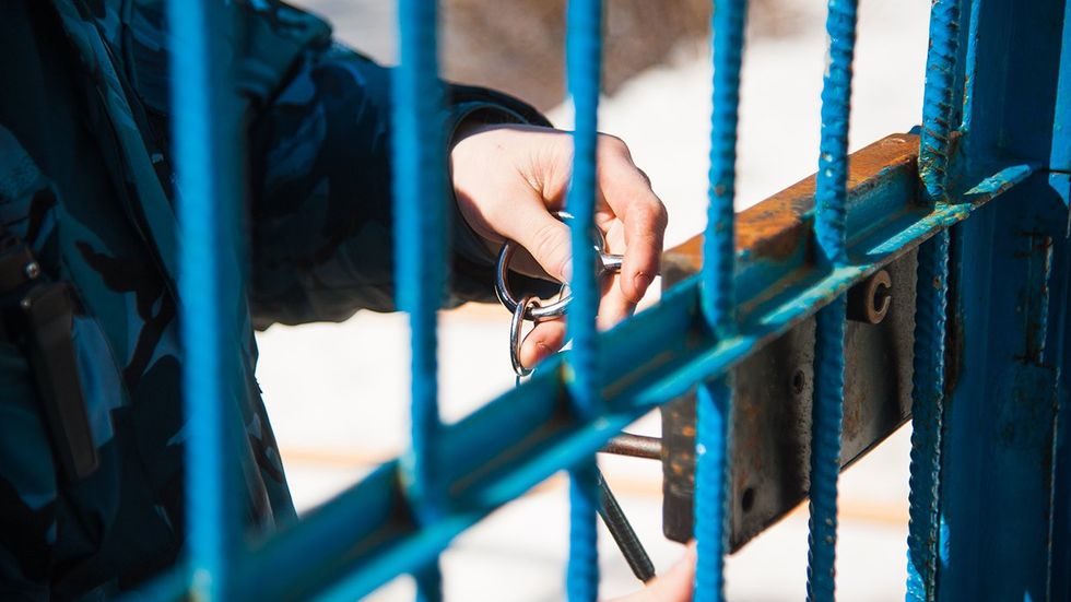 Prison Guard locking cell
