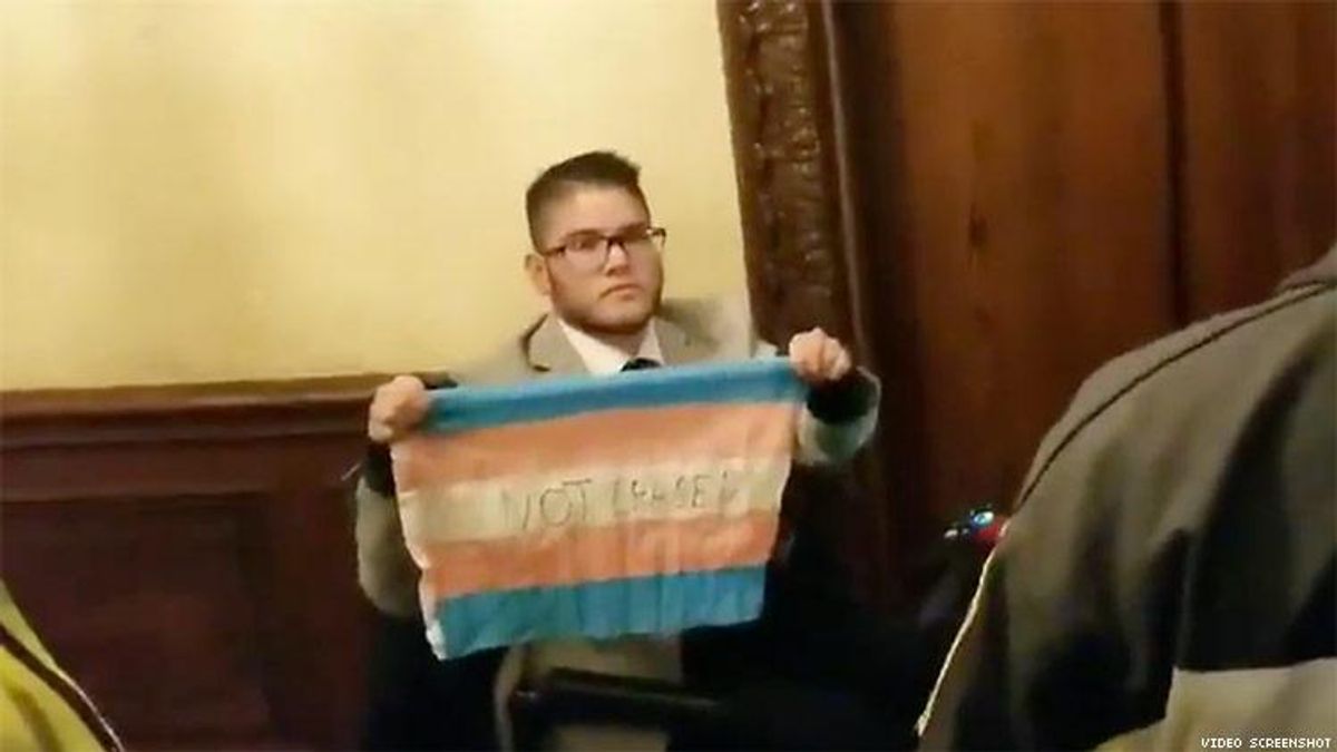 Protester with trans pride flag
