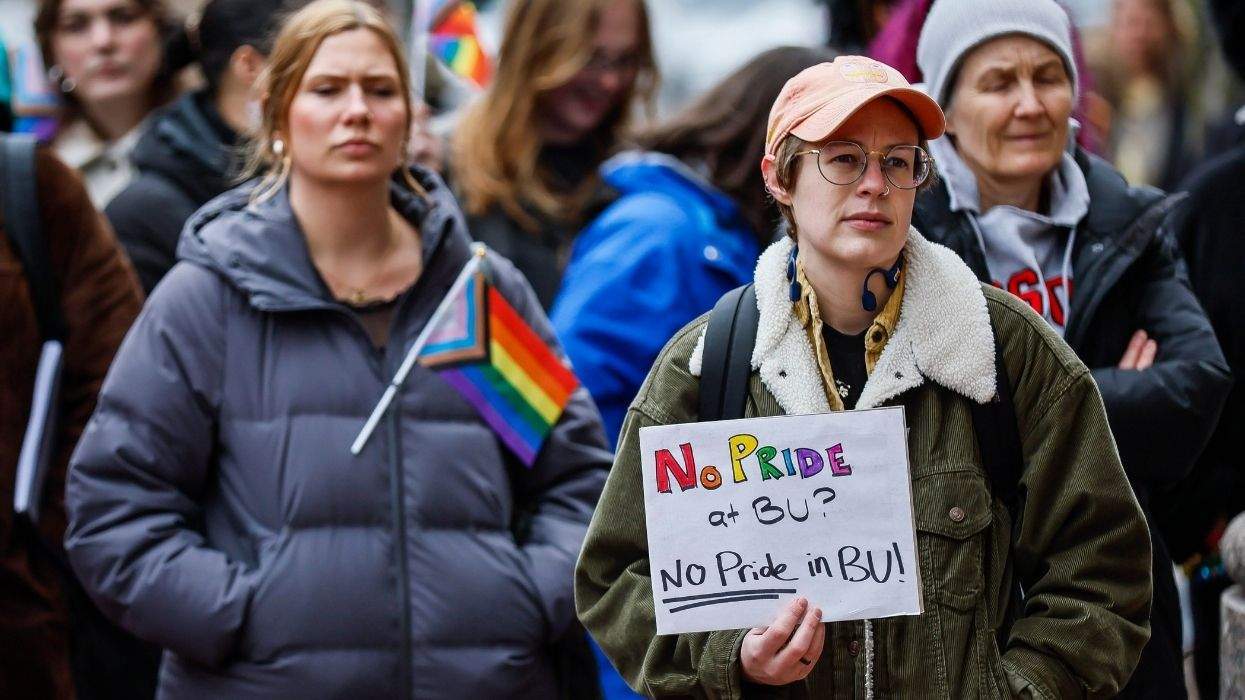 protesters at boston university holding a sign that reads no pride at bu? no pride in bu!