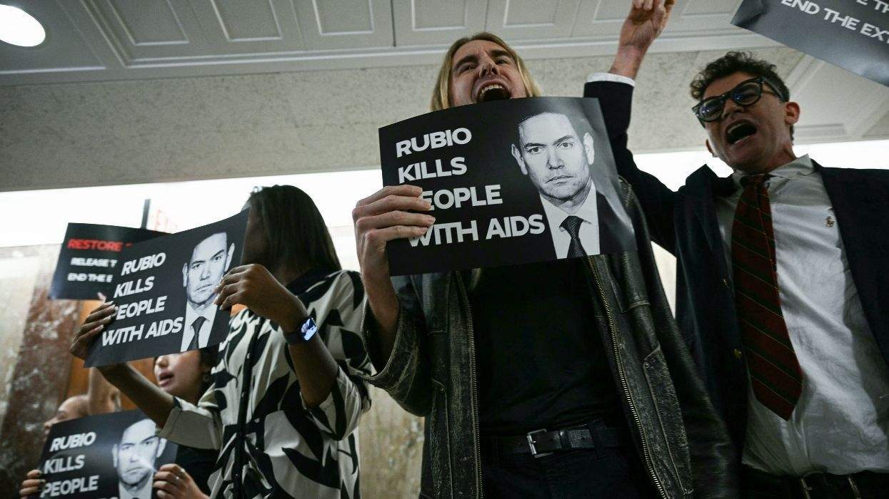 protesters with rubio kills people with aids signs