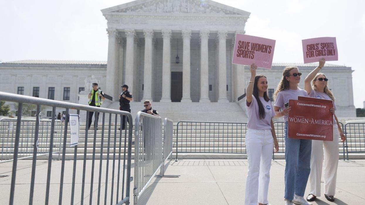 protesters with save women's sports signs at the supreme court
