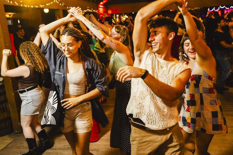 queer country line dancers