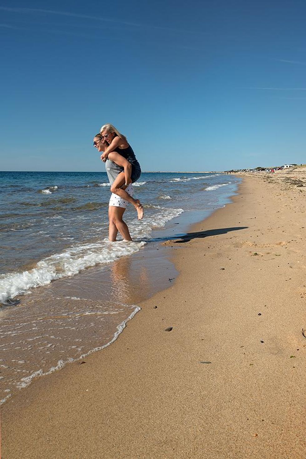 Queer couple on the beach