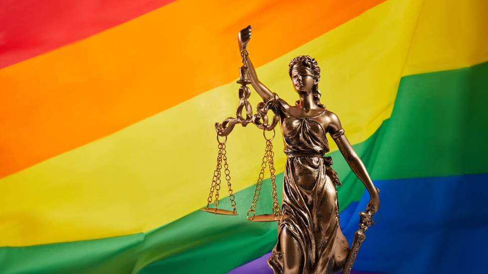 rainbow flag and scales of justice