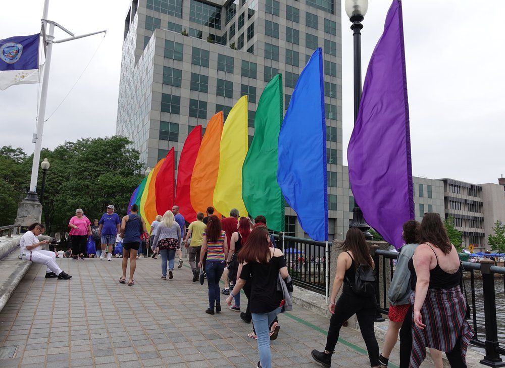 Rainbow flags on bridge over water in Providence, Rhode Island