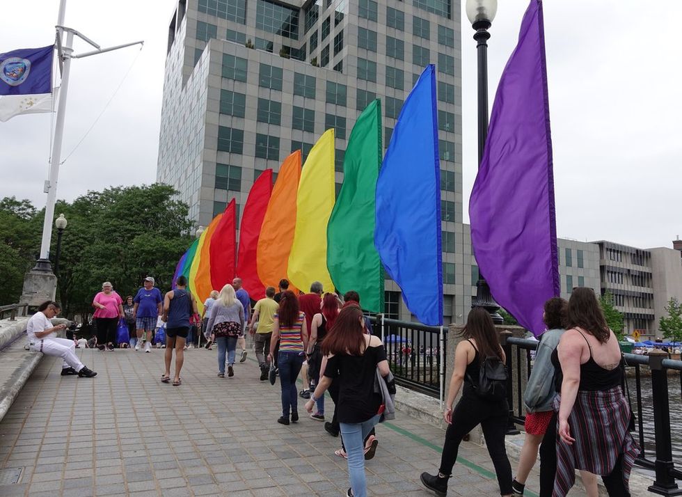 Rainbow flags on bridge over water in Providence, Rhode Island