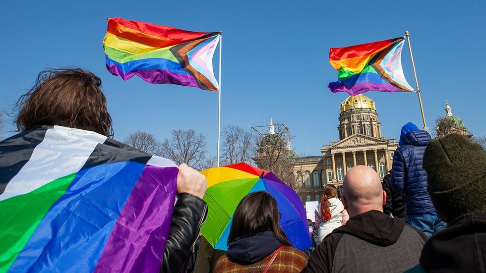 Rainbow LGBTQ Progress Pride Flags Queer Transgender Rights Rally Protest Des Moines Iowa USA State Capitol Building