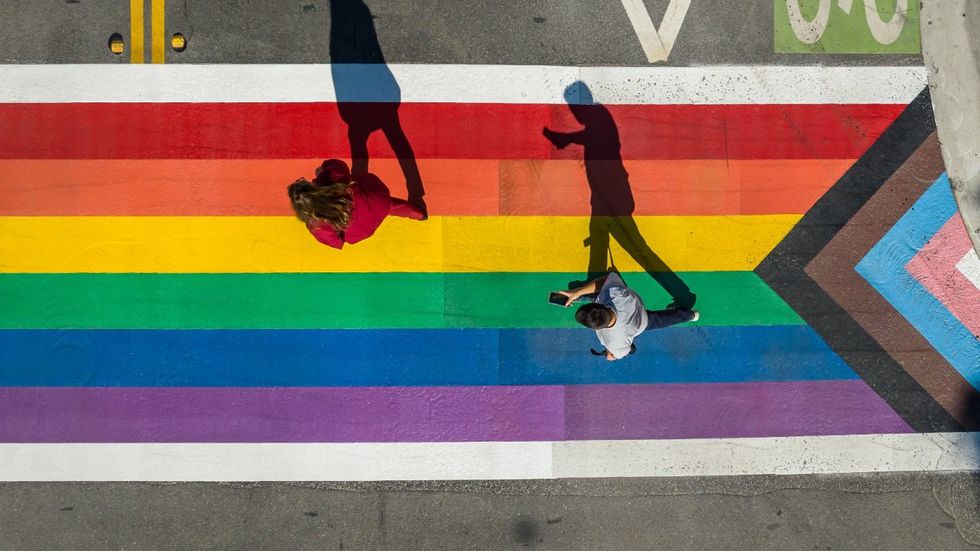Rainbow sidewalk with shadows