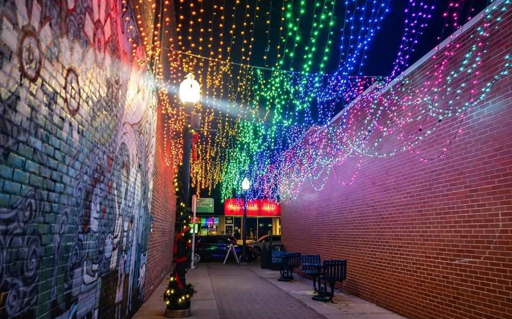 Rainbow string lights in Ferndale alley