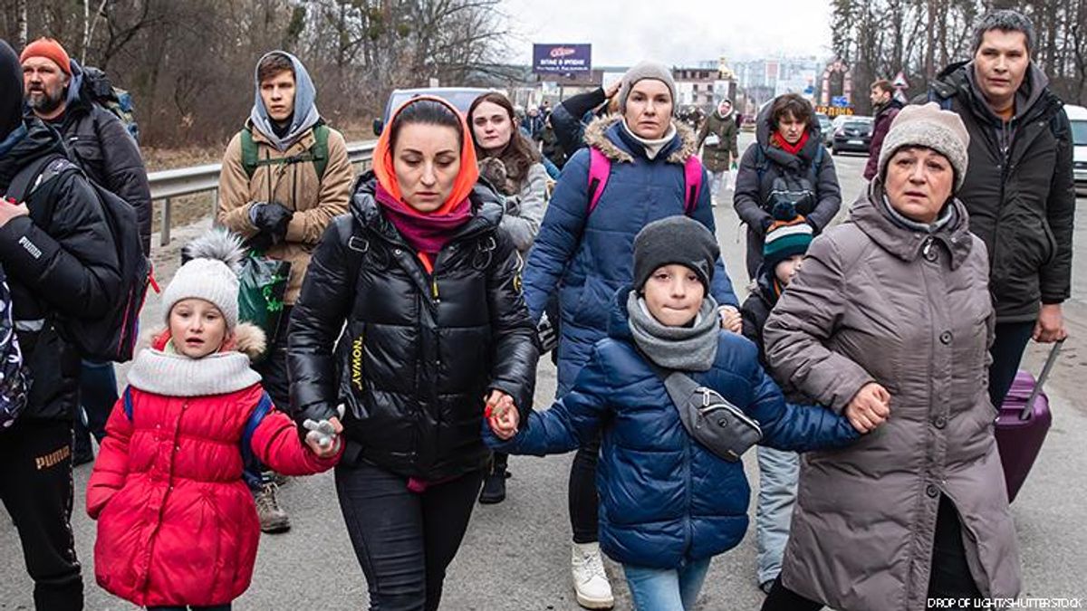 Refugees crossing a border