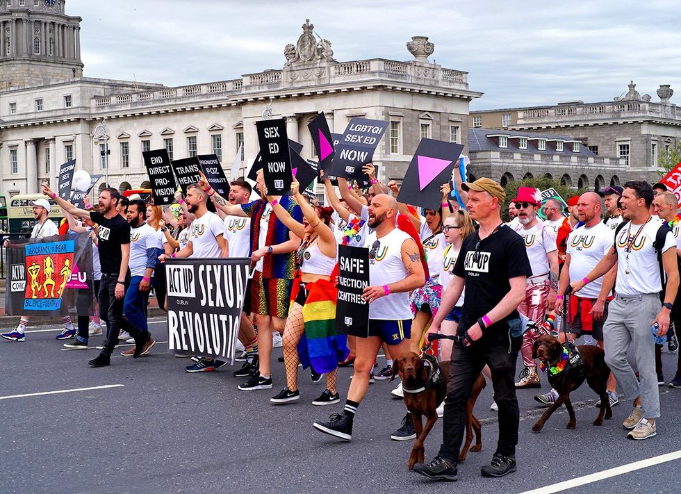 Representatives of the ACT UP Dublin group walking with banners in the Dublin LGBTQ Pride Festival in 2019