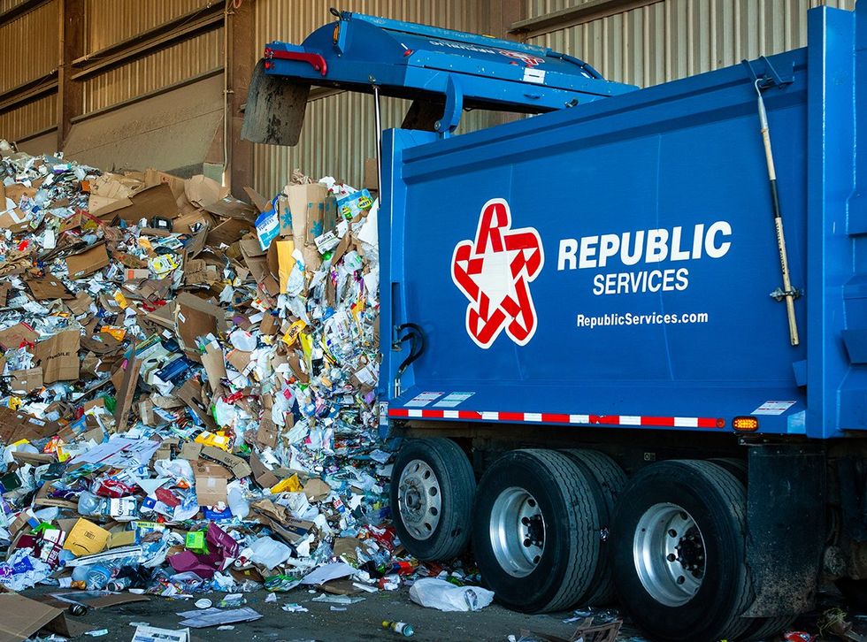 Republic Services truck being emptied