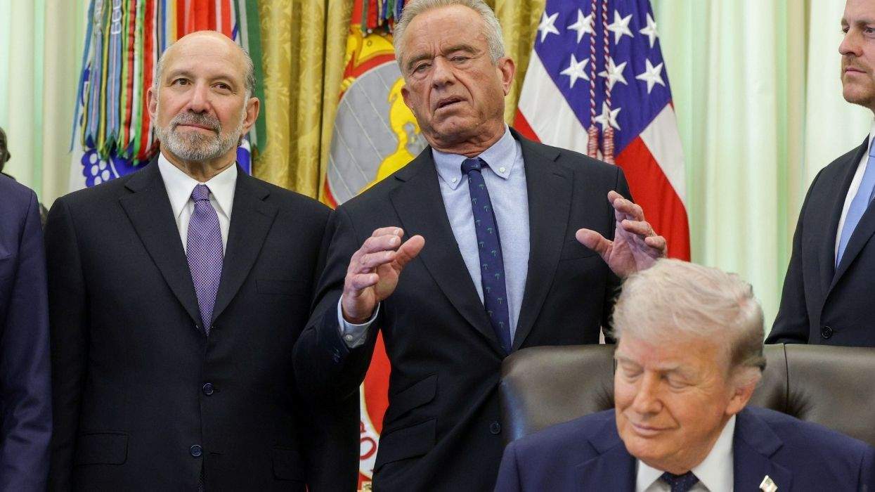 rfk jr. speaking behind trump who's sitting at the resolute desk