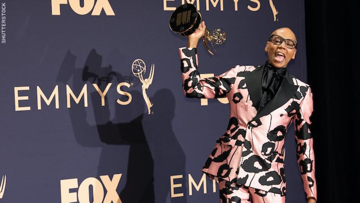 RuPaul at the Emmys with a trophy