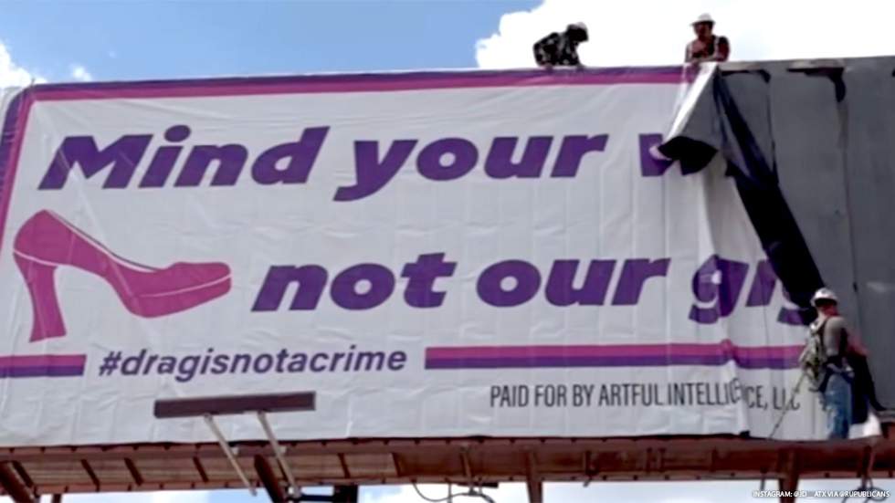 RuPublicans billboard that reads “Mind your wigs not our gigs, Greg!”