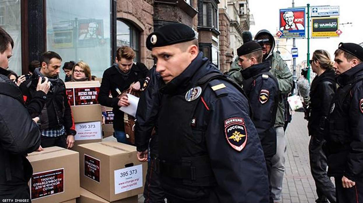 Russian policemen surround Russian gay rights activists in Moscow in 2017.