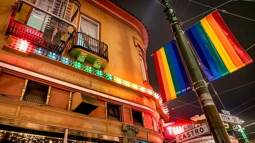 San Francisco California Castro Street gayborhood intersection rainbow street gay flags and colorful lights at night