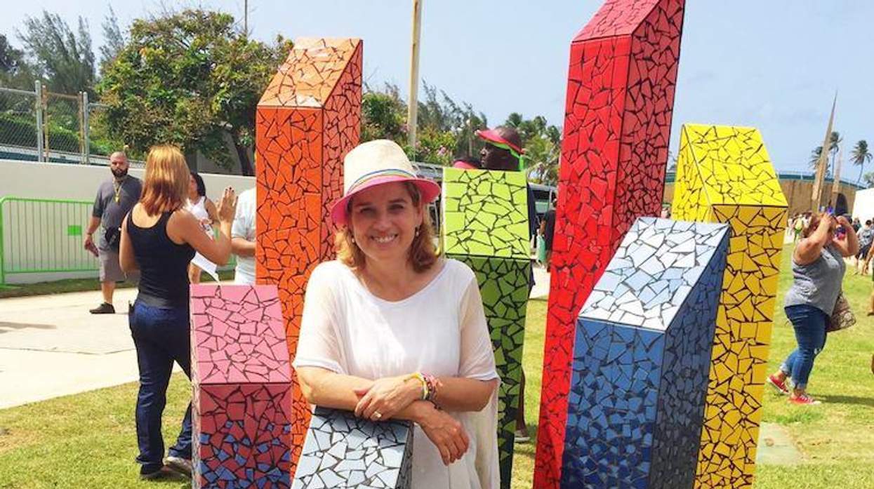 San Juan mayor Carmen Yulín poses in front of the first LGBT monument in Puerto Rico