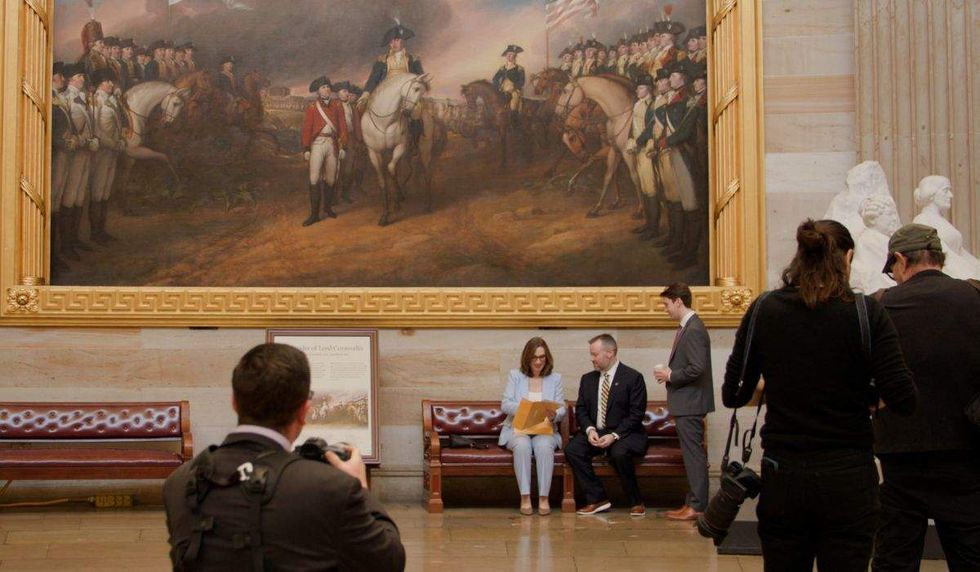 sarah mcbride and roddy flynn, her chief of staff, sit in a House office building