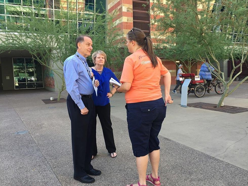 "Save yOur Kids!" canvassers prep for their work.