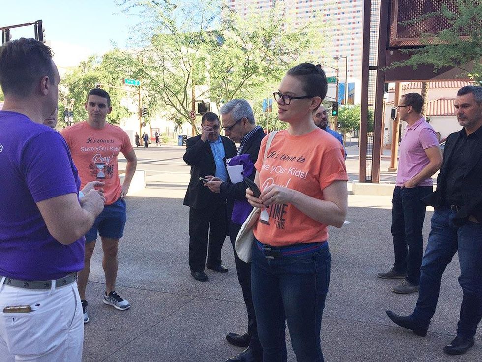 "Save yOur Kids!" canvassers prepare to engage and educate members of the Southern Baptist Convention by handing out pamphlets in front of the Phoenix Convention Center.