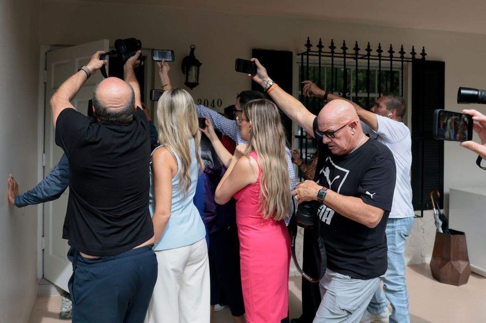 scrum of press at perez hilton's miami-area home
