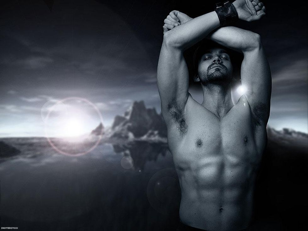 shirtless man with mountains background
