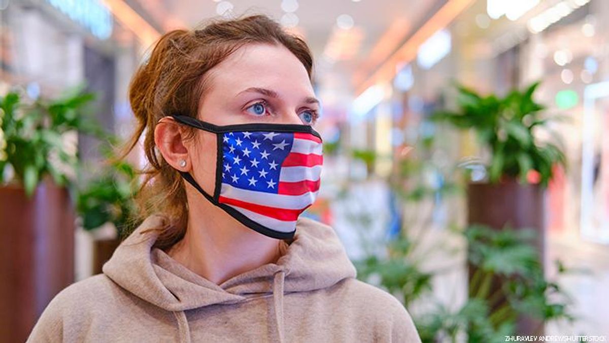 Shutterstock of someone with a flag as mask