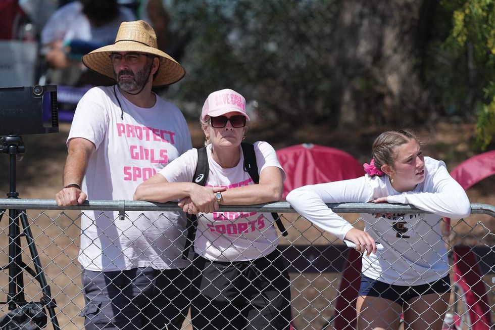 Spectators wear 'protect girls sports' t-shirt at the state finals that AB Hernandez participated in.