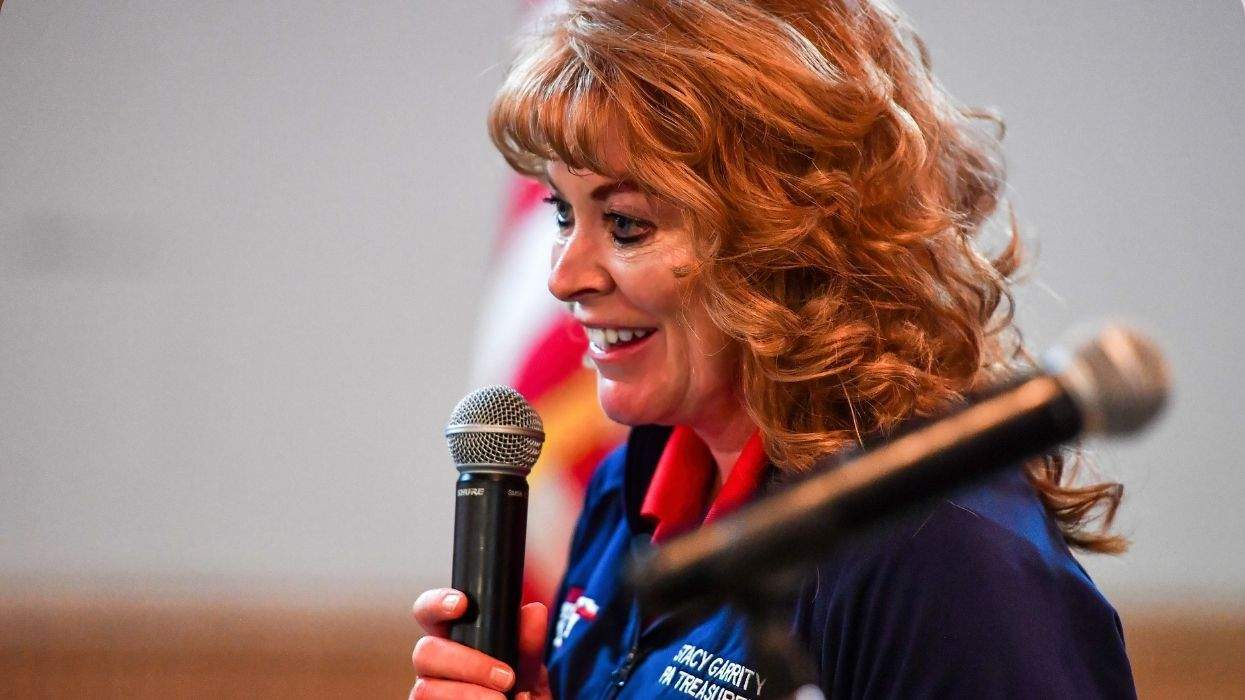 stacy garrity holding a microphone